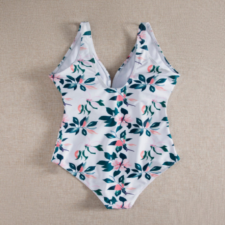 Dame én-delt badedragt med elegant snøre detaljer og floralt design Stilla
