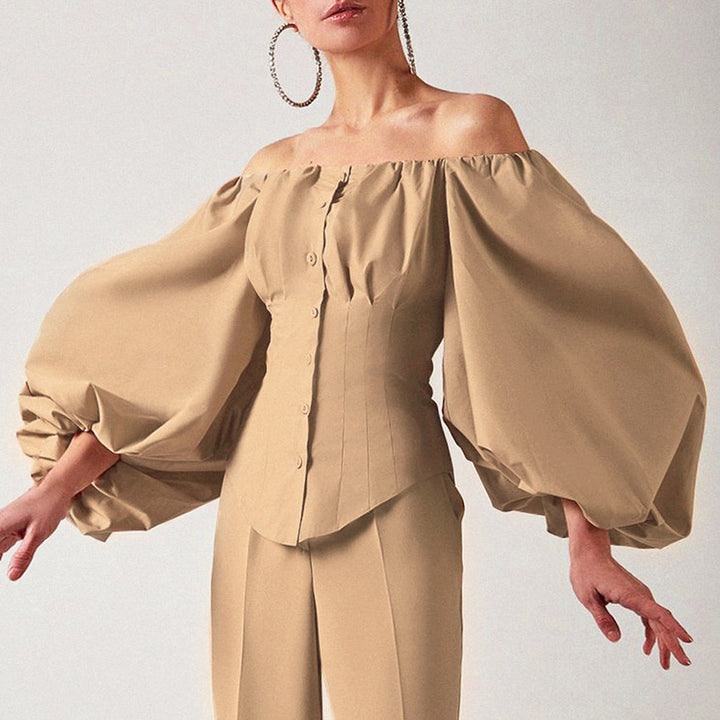 Damebluse med off-shoulder design og voluminøse pufærmer Stilla