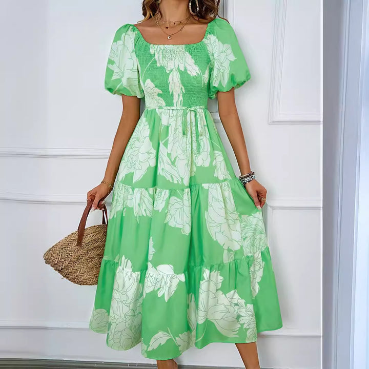 Dame sommerkjole med elegant puffærme-design og floralt mønster Stilla