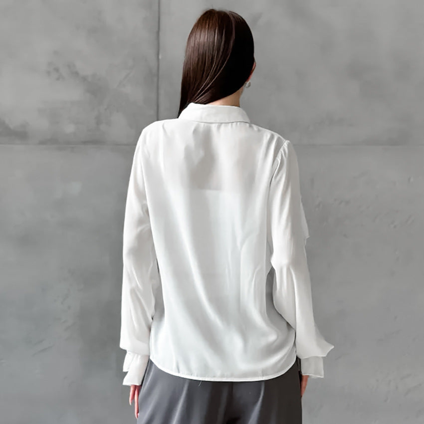 Damebluse med flæsedetaljer og elegante accenter Stilla