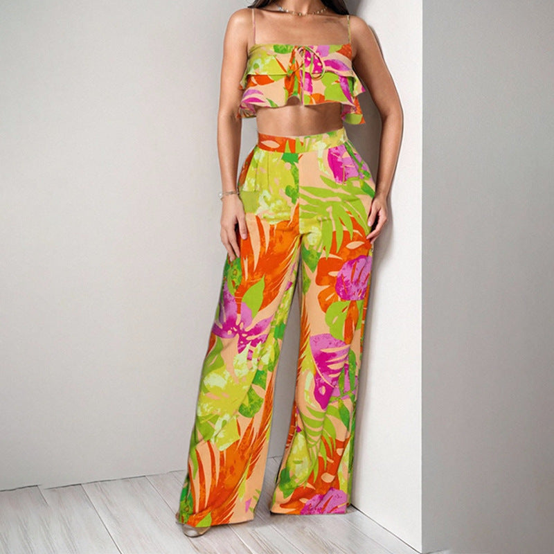 Dame to-delt sommeroutfit med ruffle-bluse og vide bukser Stilla