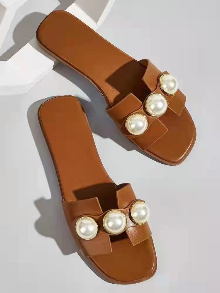 Dame pantoletten med elegant perle-design og moderne rem Stilla