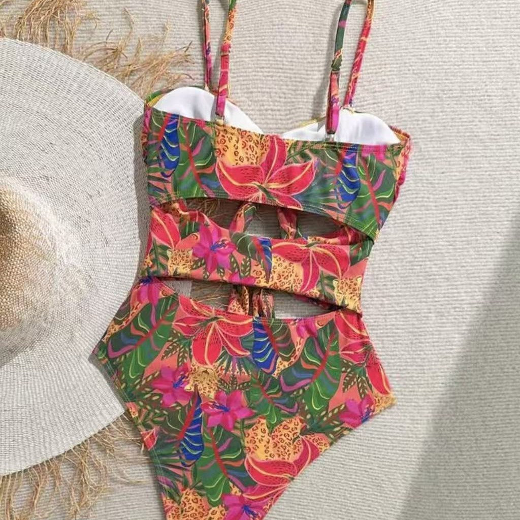 Dame one-piece badedragt med dekorativ knude detalje og legende blomstermønster Skovae