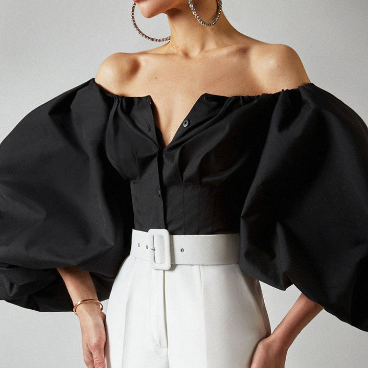 Damebluse med off-shoulder design og voluminøse pufærmer Stilla