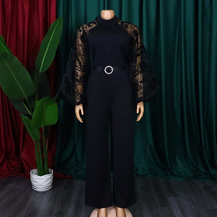 Dame jumpsuit med transparente puffærmer og taljerbar bælte Stilla