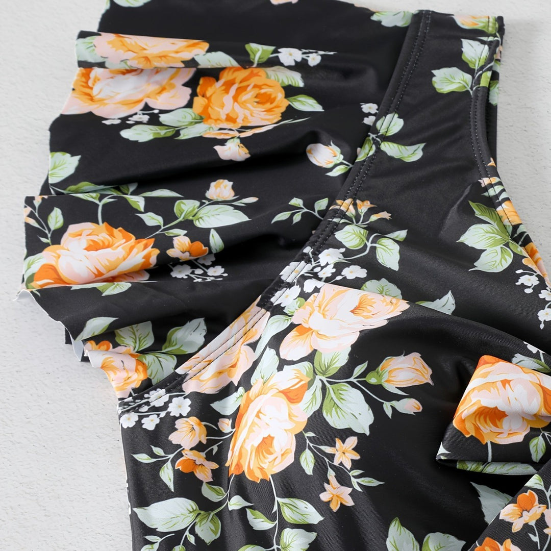 Dame én-delt badedragt med ruffledetails og blomstret design Skovae