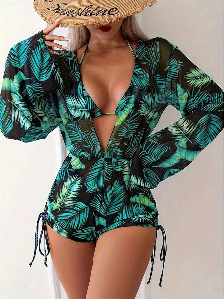 Dame swimsuit with elegant V-neckline and playful palm print Skovae
