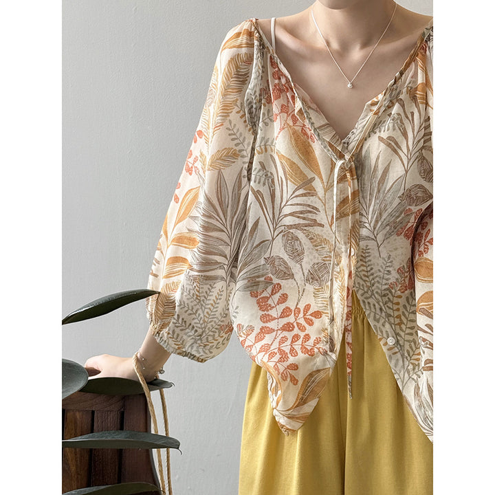 Damebluse med blomstertryk og justerbart bindingbånd Stilla