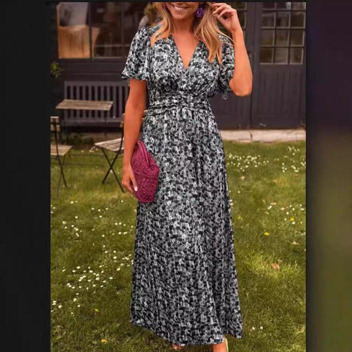 Dame maxikjole med elegant blomsterdesign og dyb V-udskæring Stilla
