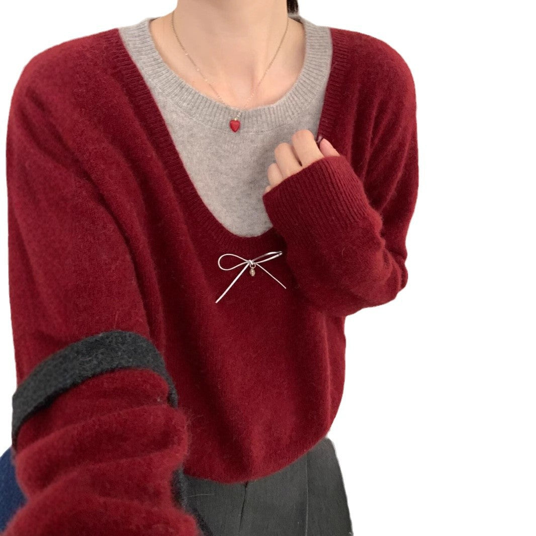 Kvindesweater med elegant V-hals og premium bueapplikation Stilla