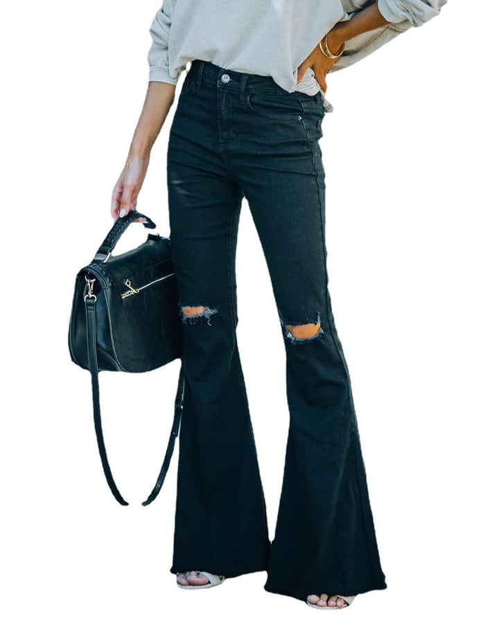 Damejeans i det trendy flared-snit med afslappede ripped-detaljer Stilla