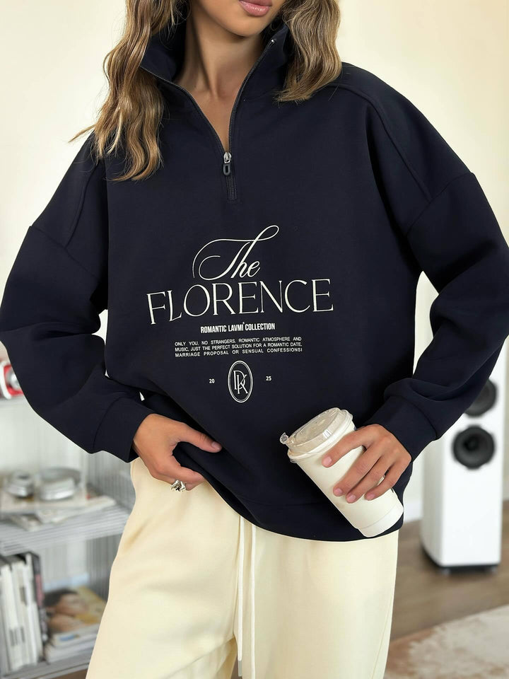 Kvinders statement sweater med høj krave og praktisk lynlås Stilla