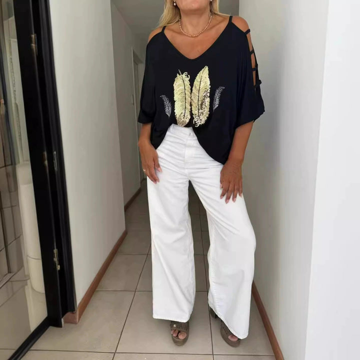 Dame Oversized T-shirt med kreative cut-outs og iøjnefaldende tryk Stilla