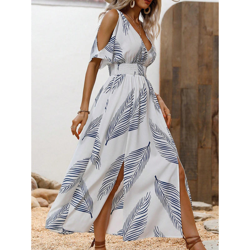 Dame maxikjole med elegant cut-out-design og flydende kant Stilla