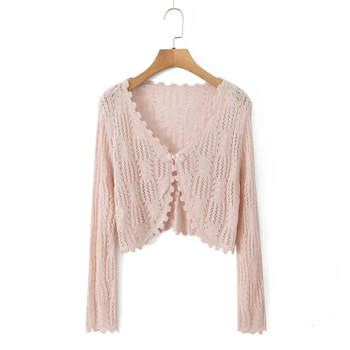 Dame strikcardigan med fint hulmønster og elegante flæsedetaljer Stilla