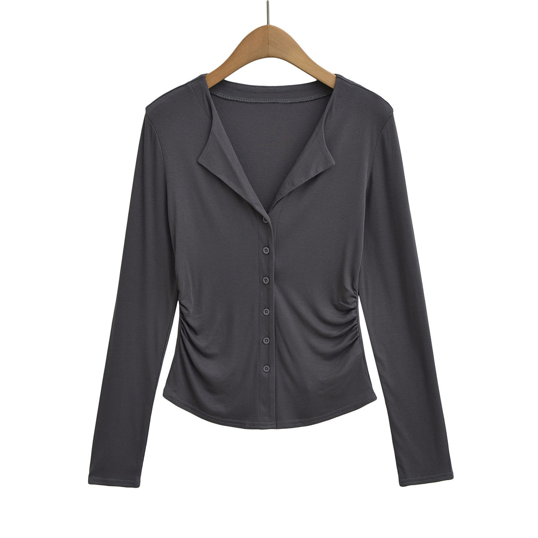 Dame figursyet top med knaplukning og moderne draperingseffekt Stilla
