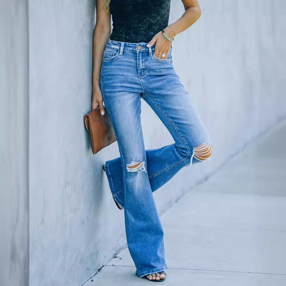 Dame udvidede jeans i retro stil med modne slidte effekter