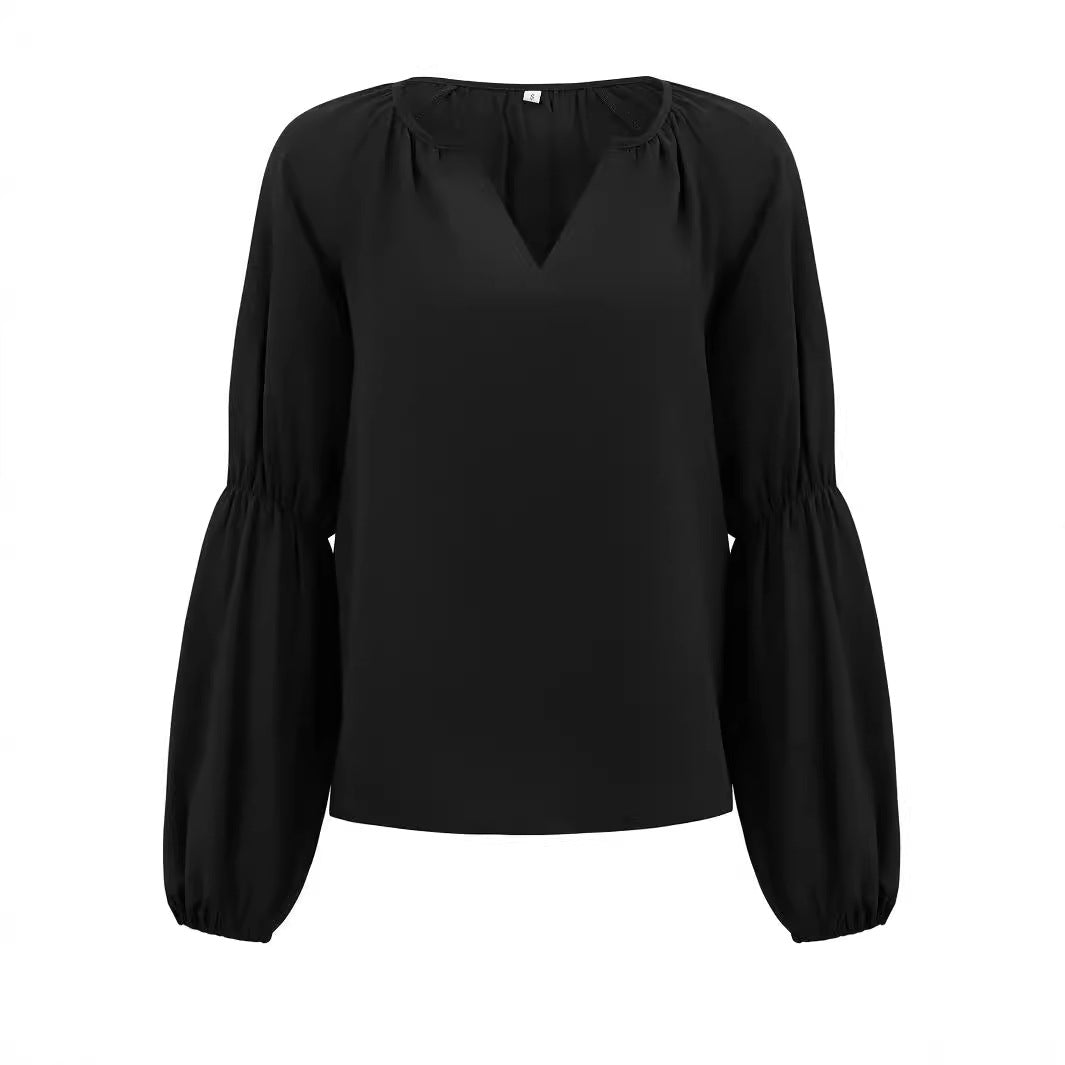 Damebluse med voluminøse ærmer og V-udskæring Stilla