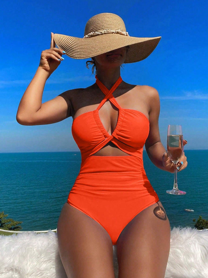 Dame én-del badesuit med stilfuld kryds-design Skovae