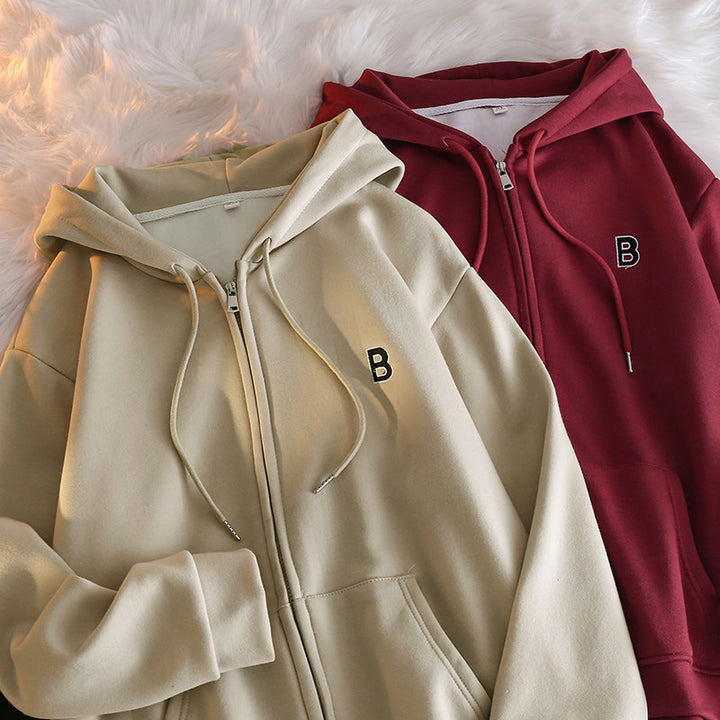 Femme Cozy Zip-Up Hoodie med elegant broderet detalje Stilla