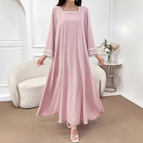 Kvinders elegante maxi kjole med dekorative frynser og brede ærmer Skovae