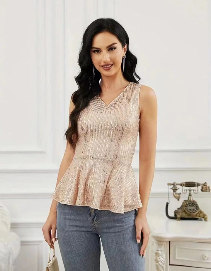 Dame Peplum top med skinnende pailletdetaljer og elegant snit Stilla