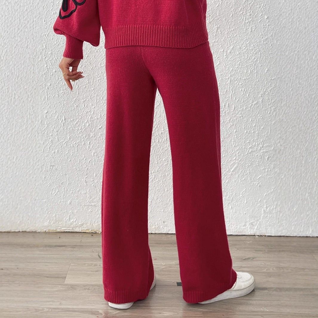 Dame strikbukser med blomstret design og bredt ben Stilla
