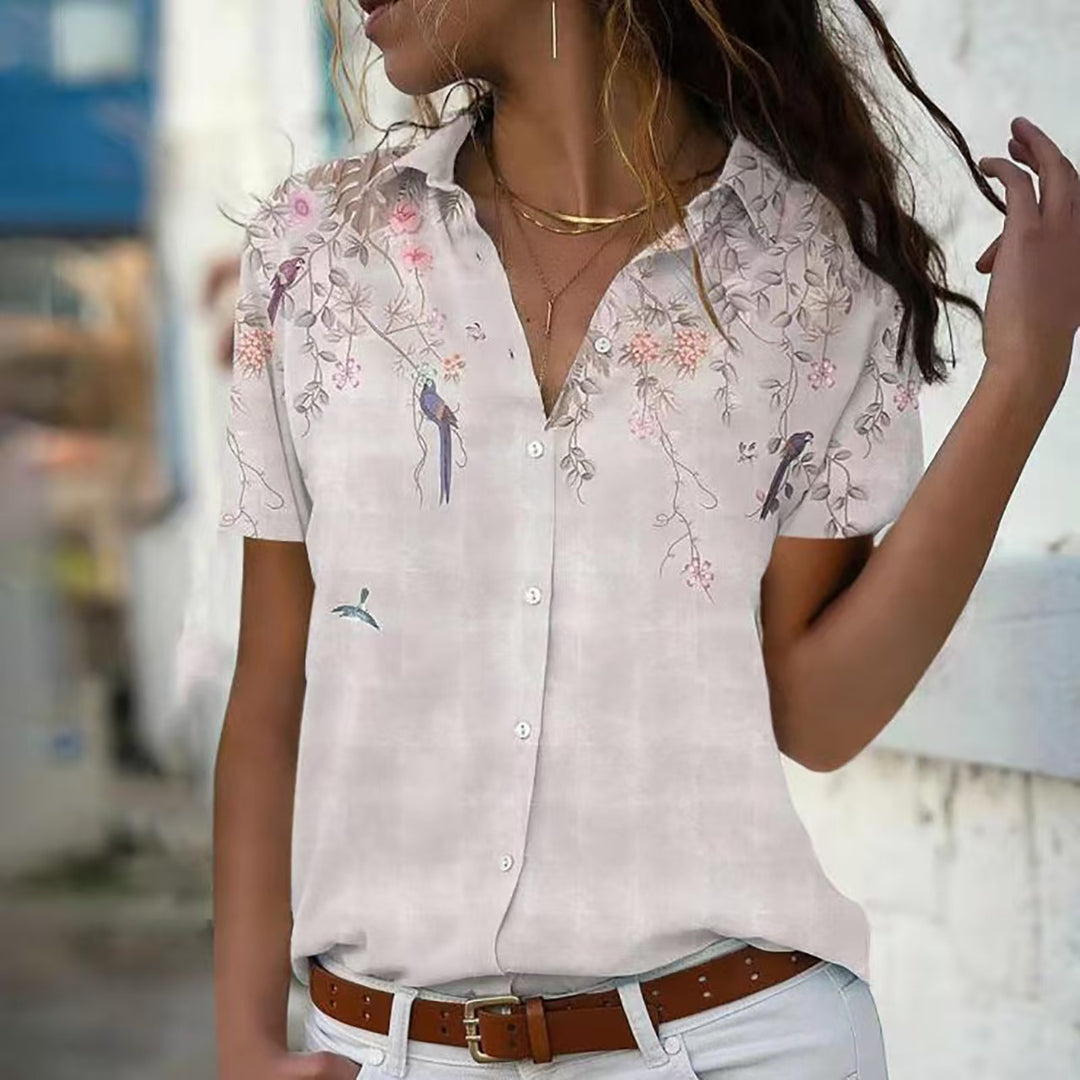 Damebluse med blomsterdesign og elegant snit Stilla
