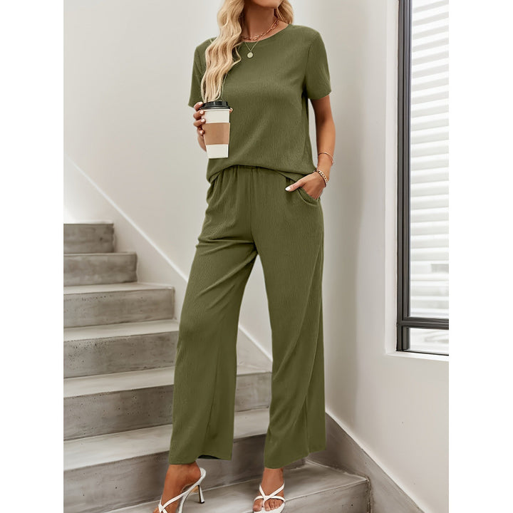 Dame kortærmet jumpsuit med flæse detaljer og bindebælte Skovae