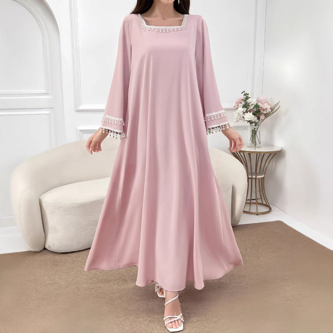 Kvindelige elegante maxi kjoler med dekorative franje og brede ærmer