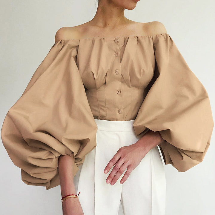 Damebluse med off-shoulder design og voluminøse pufærmer Stilla