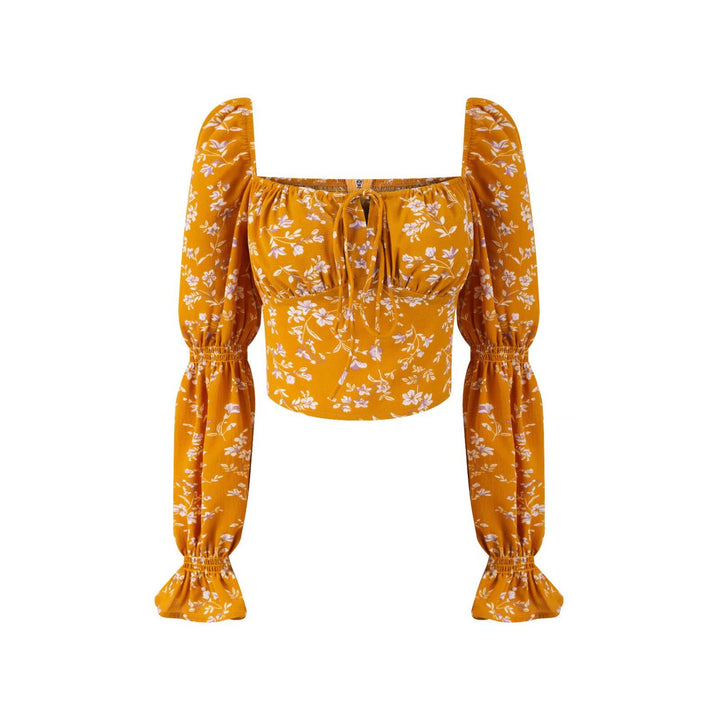 Dame Crop-top med ballonærmløs design og sarte blomsteraccenter Stilla