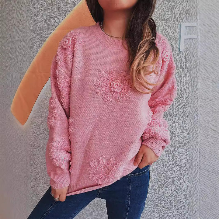 Kvindernes glade sweater med blomsterapplikationer og tekstureret strikdesign Stilla