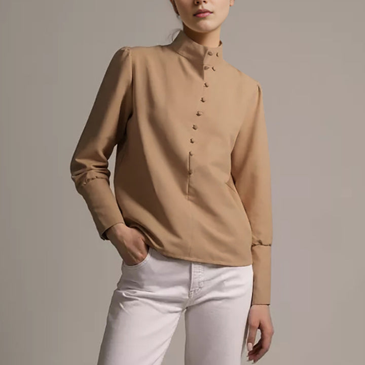 Damebluse med høj ståkrave og elegante pufærmer Stilla