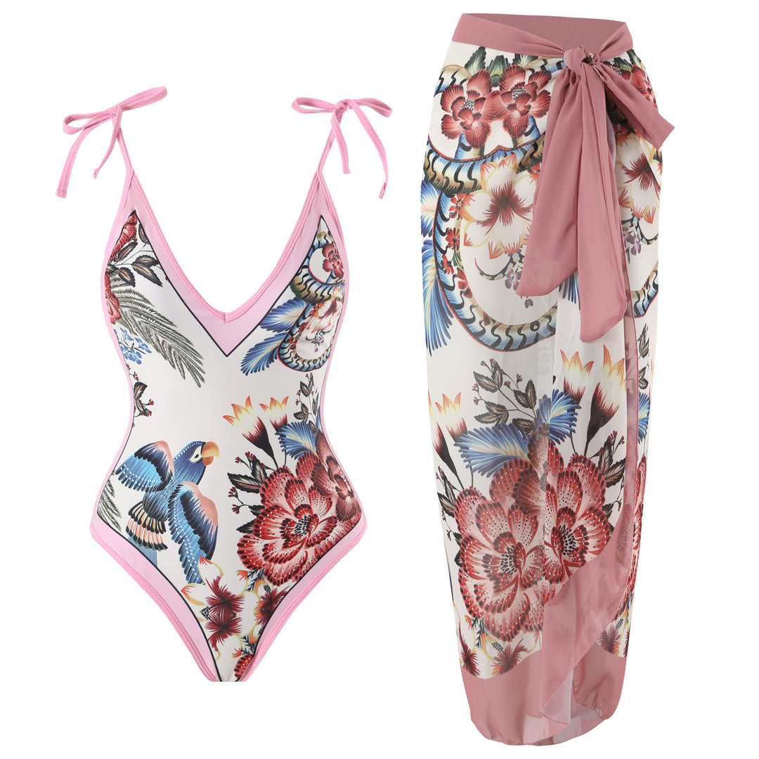 Dame heldragt badedragt med floralsk design og elegant omslagsskørt Stilla