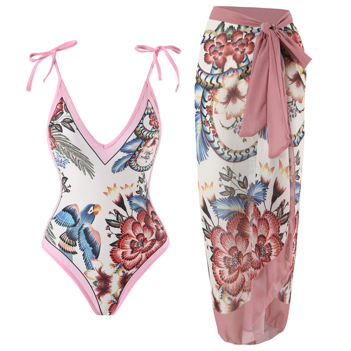 Dame heldragt badedragt med floralsk design og elegant omslagsskørt Stilla
