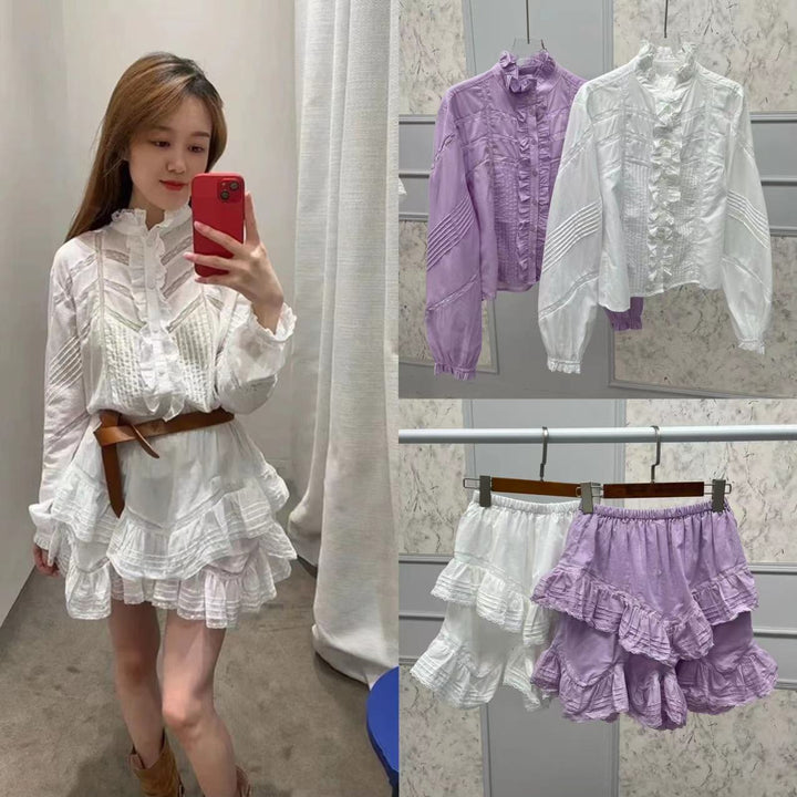 Damebluse med flæsedetaljer og modematerialer Stilla