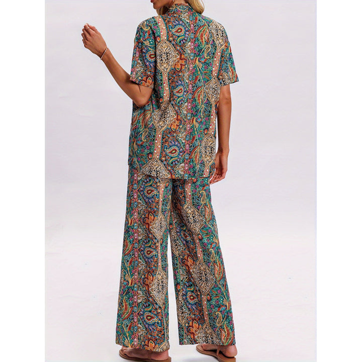 Dame kortærmet jumpsuit med flæse detaljer og bindebælte Skovae