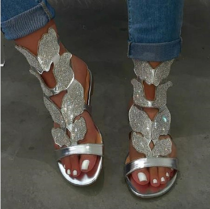 Dame Glitrende Sandaler med blomsterdesign og elegant rem Stilla
