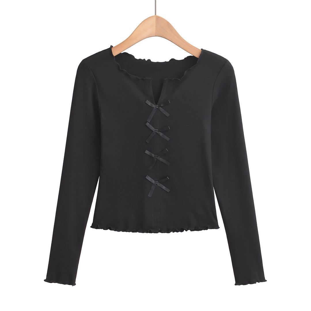 Dame elegant top med floral skæring og fine sløjfedetaljer Stilla