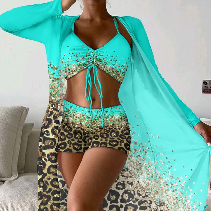 Dame strandoutfit med dyremønster og elegante accenter Stilla