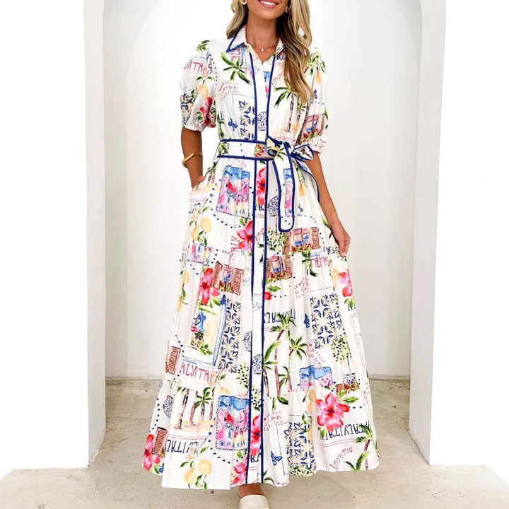 Dame maxikjole med farverig blomsterprint og et elegant bælte Stilla