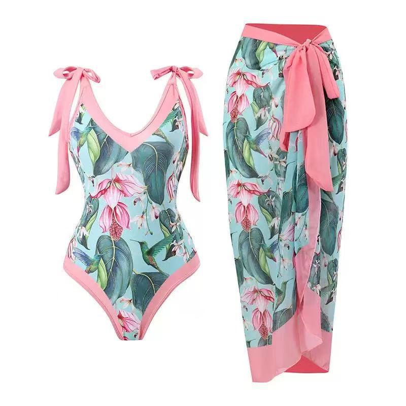Dame badedragter med blomstret design og gennemsigtig omslagskørt Skovae