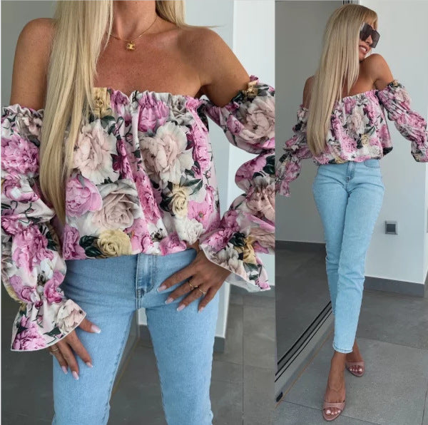 Damebluse med voluminøse rynkede ærmer og blomstret tryk Stilla