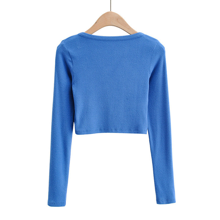 Dame cropped langærmet shirt med knapdetaljering og fin struktur Stilla