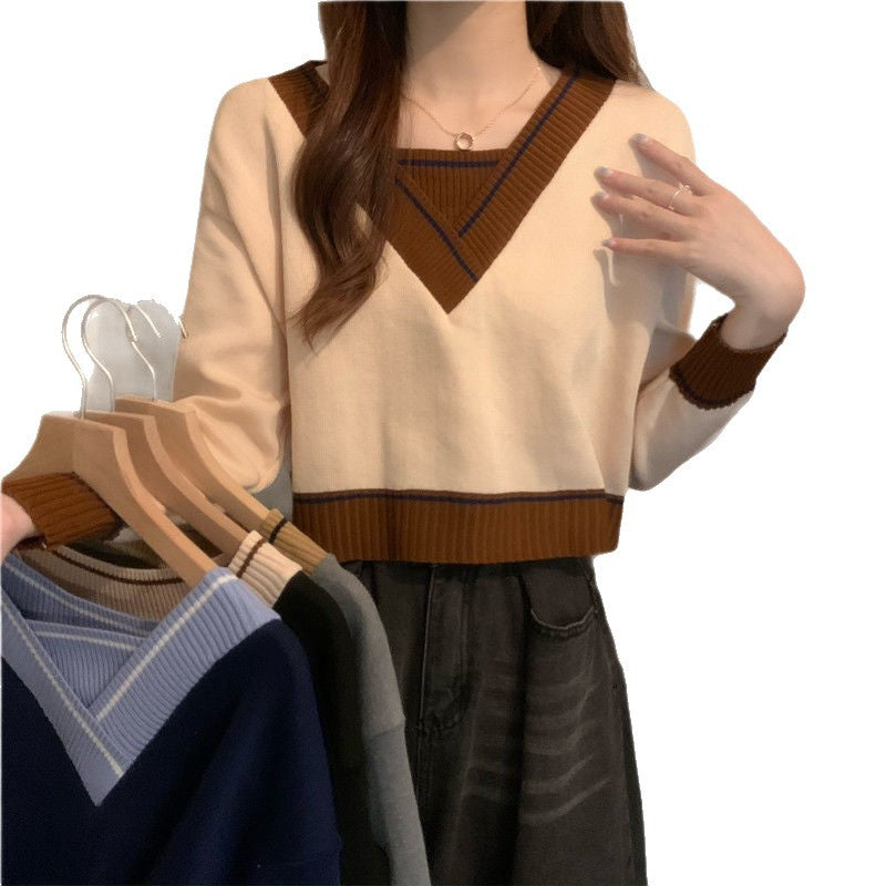 Damer modevenlig V-hals sweater med kontrastdetaljer Stilla
