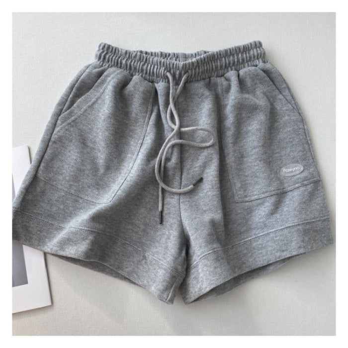 Kvindernes afslappede joggingshorts med elastisk talje og praktiske sidelommer