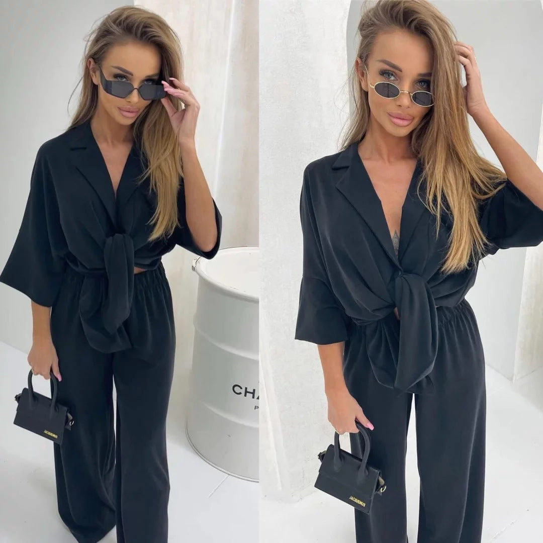 Kvinders afslappede jumpsuit med bælte og bredskårede ben