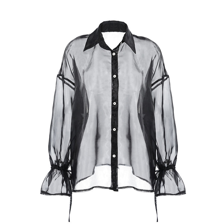 Dame chiffonbluse med gennemsigtige ærmer og elegant knaplukning Stilla