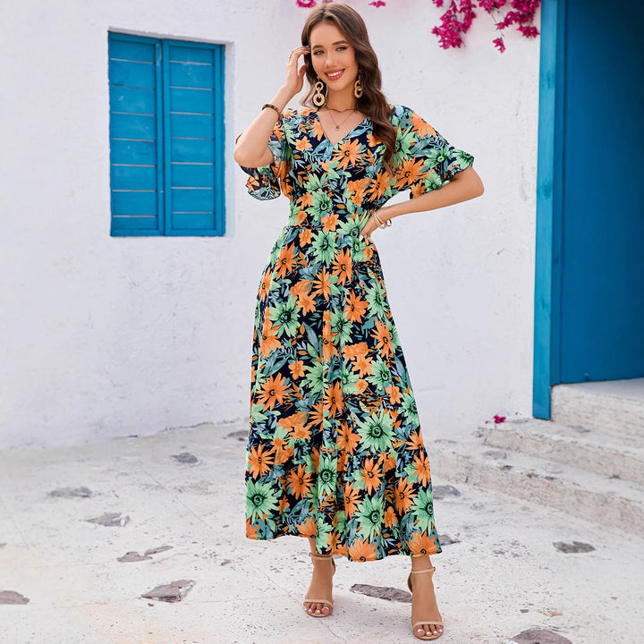 Dame maxikjole med blomstret design og svingende kant Stilla